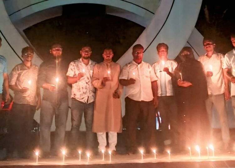 Candle-lighting program by NCP and Jatiya Yuba Shakti in Domar in memory of the July martyrs.